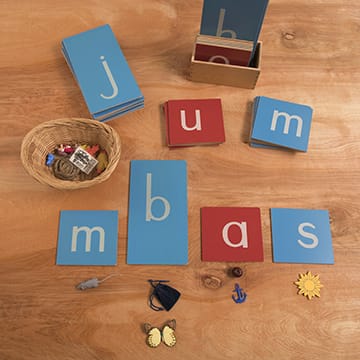 Sandpaper letters and basket on table