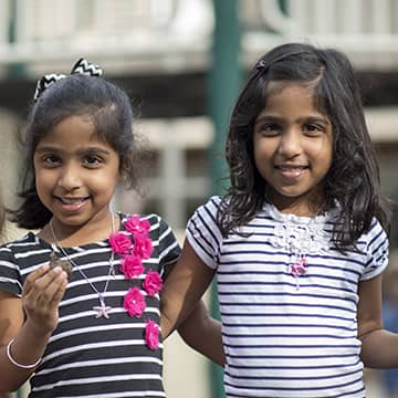 Admissions_TwoGirls Two girls happy outside